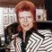 Image 6: British rock singer, David Bowie, poses beside his